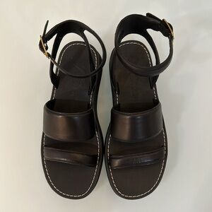 Jcrew black leather sandal with stitching.